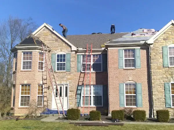 A shingle roof installation in Hamilton, OH - Haubner Construction hard at work