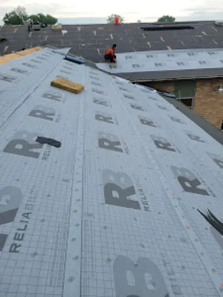 A shingle roof installation in Hamilton, OH - Haubner Construction hard at work