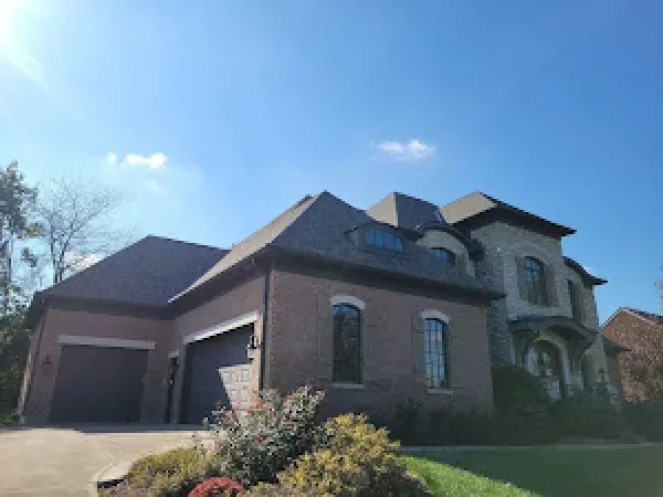 A shingle roof installation in Hamilton, OH - Haubner Construction hard at work