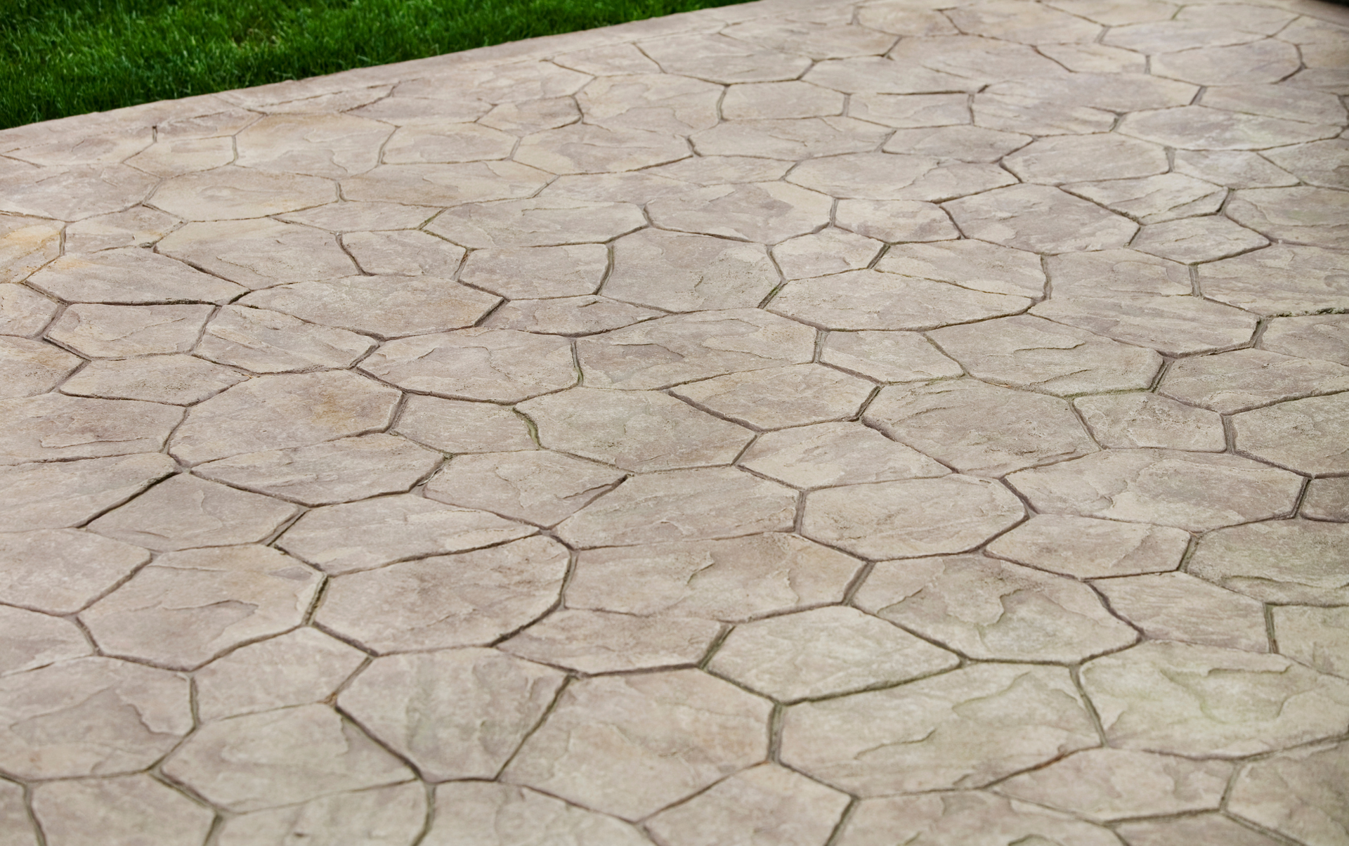 A concrete patio with a hexagonal pattern on it