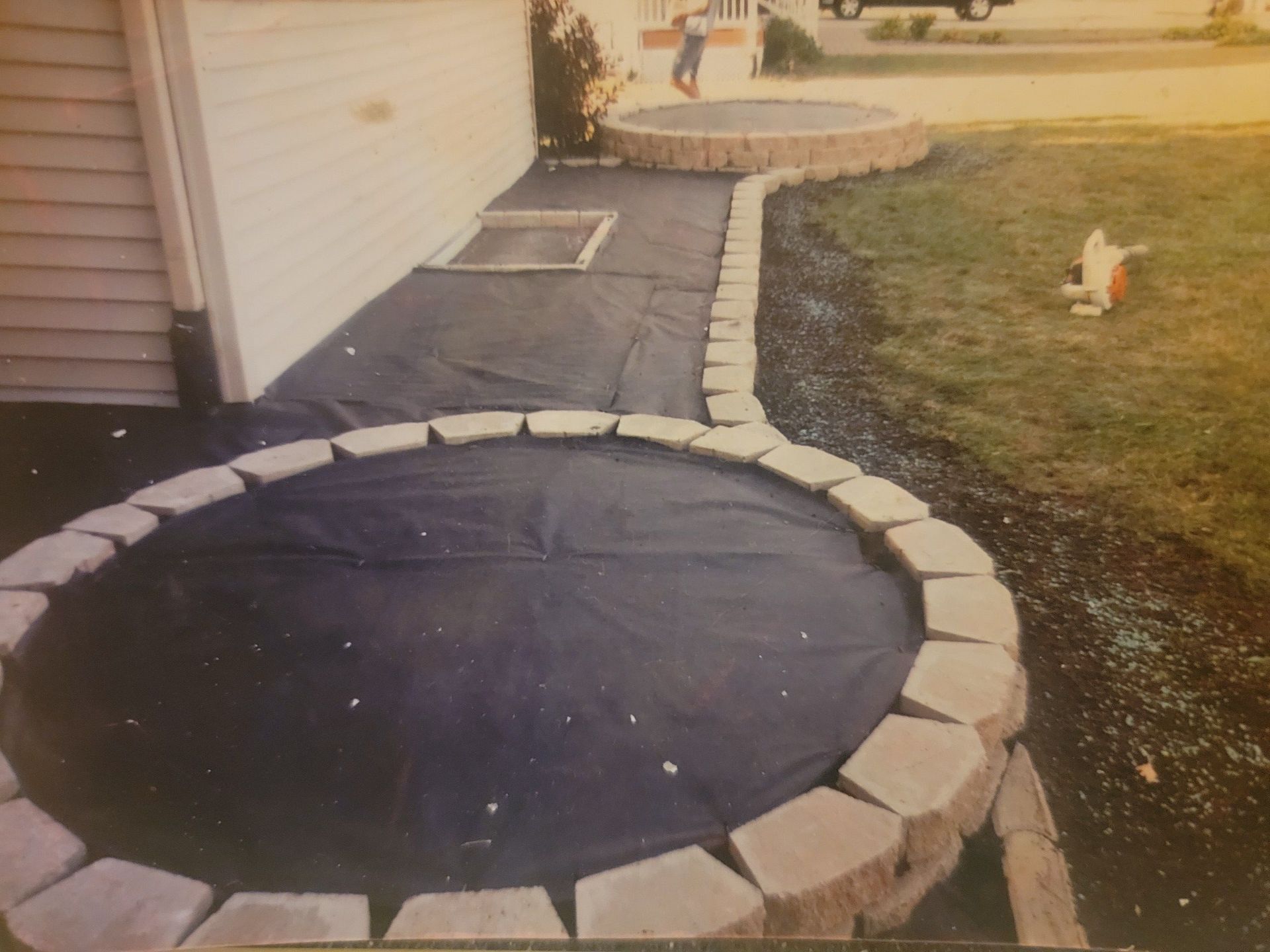 A black and white photo of a stone walkway