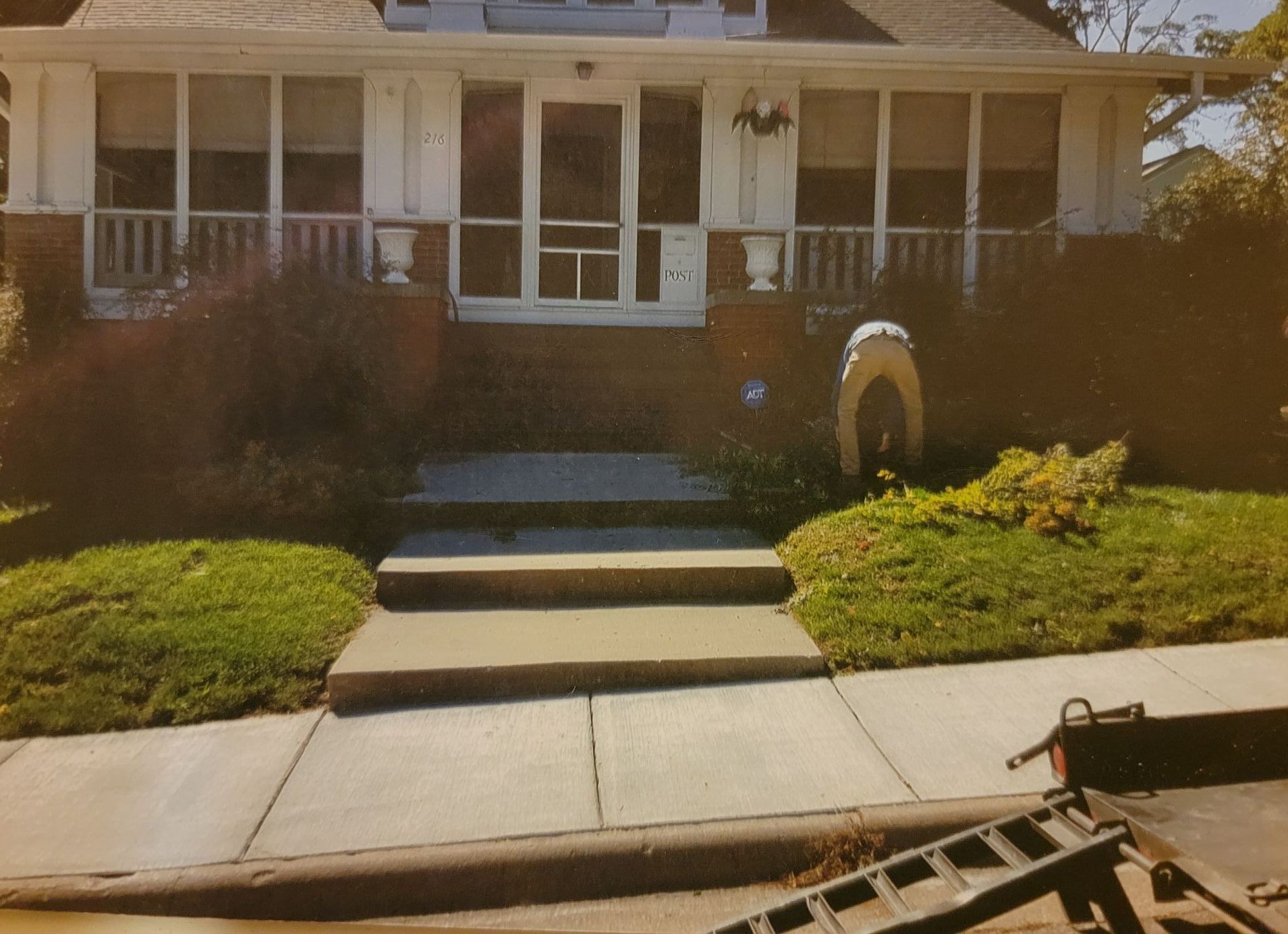 A picture of a house with a ladder in front of it