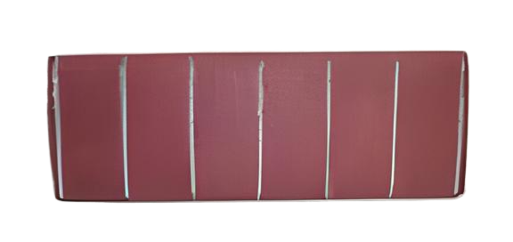 A rectangular object, possibly a cushion or headrest, with vertical lines and a burgundy color.