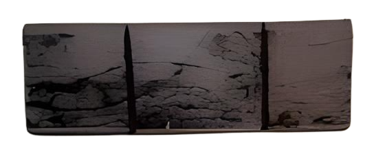 Three dark rectangular panels with textured surfaces, possibly a stone or mural.