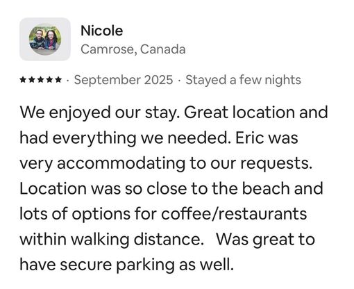 A five-star review from Nicole in Camrose, Canada, praising the location, amenities, parking, and host, Eric.