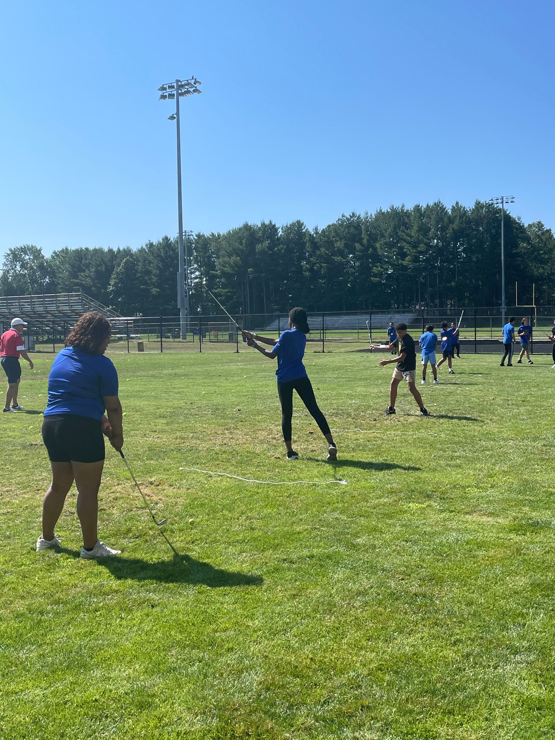 A group of people are playing baseball on a field.