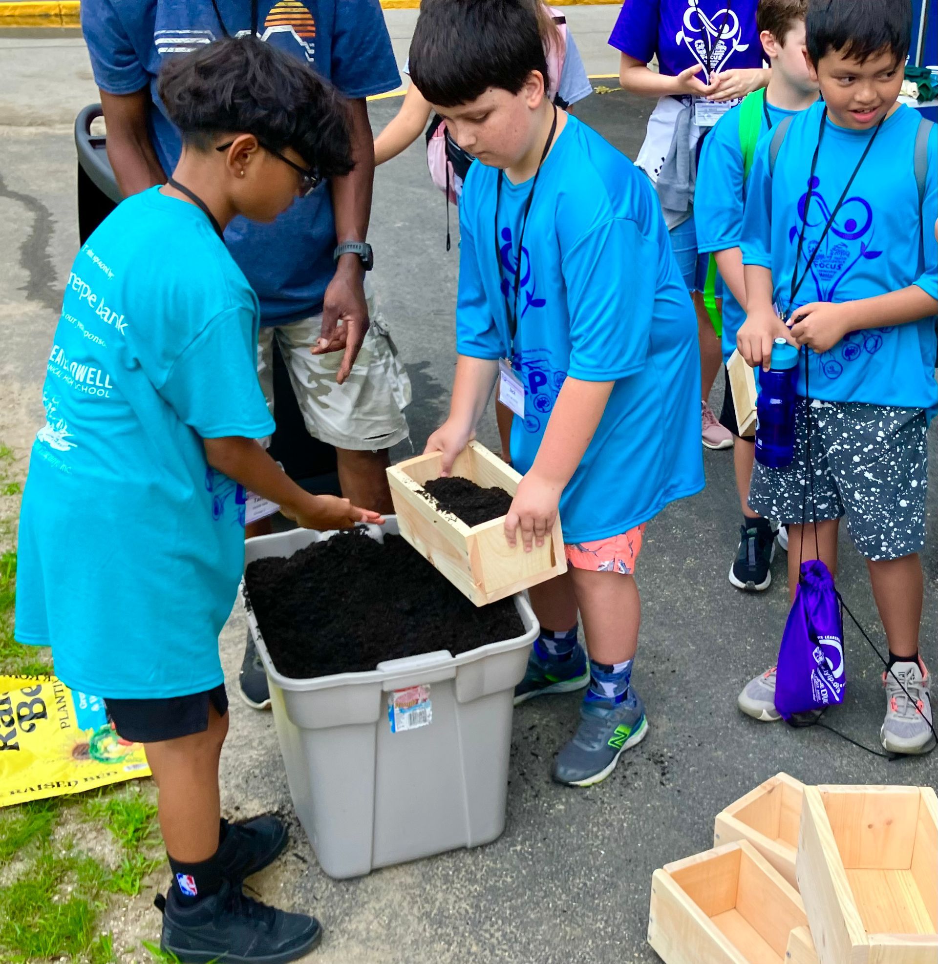 A boy wearing a blue shirt that says ' oakland ' on it