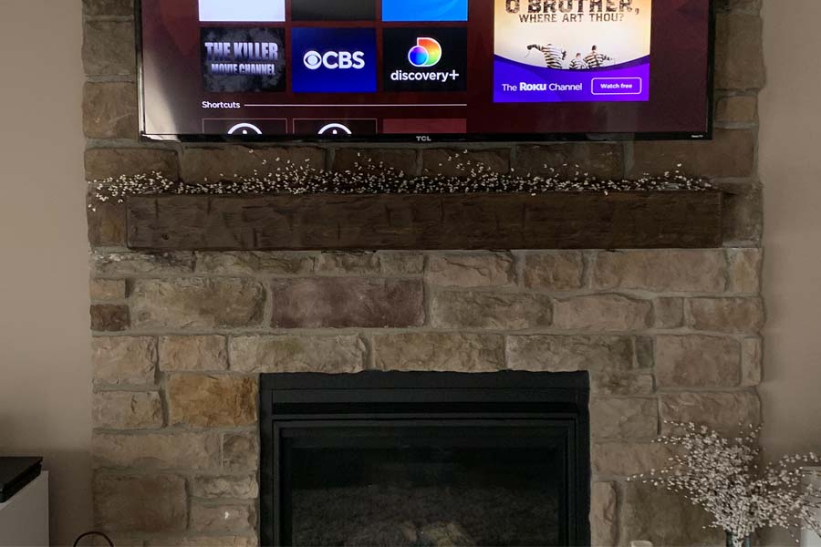 Fireplace mantel made from solid wood beam and hand hewn