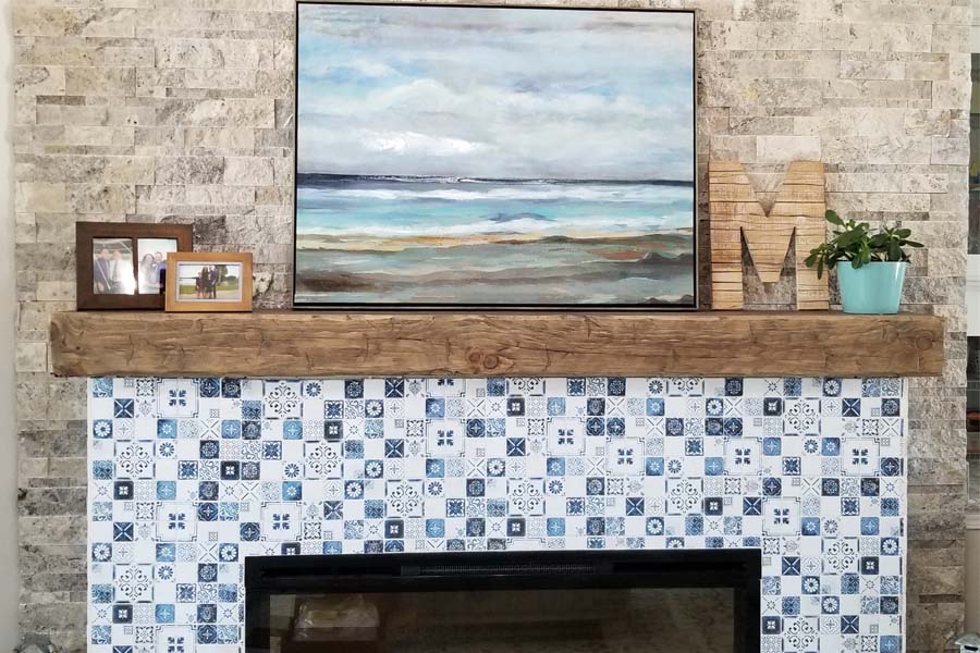 Tile fireplace with farmhouse hand hewn wood barn beam mantel