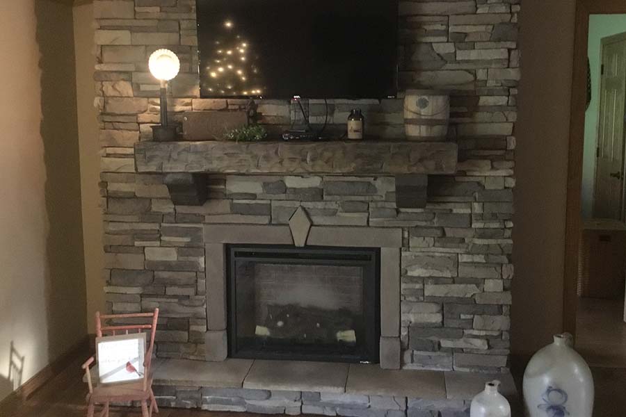 Solid wood weathered rustic fireplace mantel and corbels