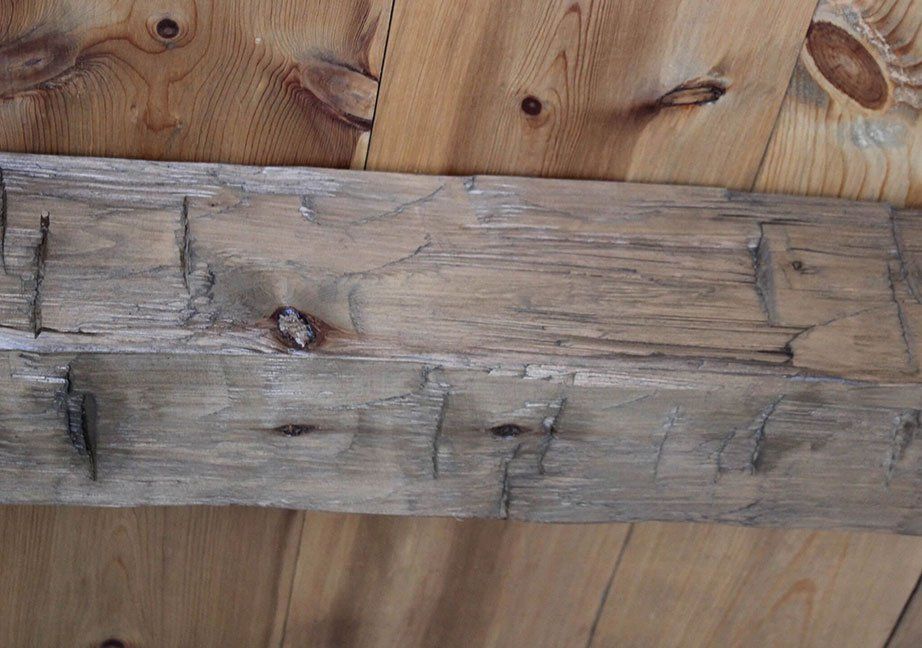 Hand hewn and amish crafted custom made wood box beam covers for ceiling and posts and columns