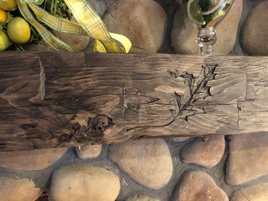 Hand carved barn wood beam natural fireplace mantel