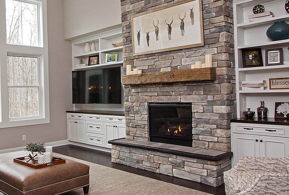 Two story fireplace with solid wood hand hewn mantel