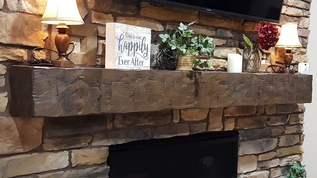 Rustic barn beam mantel for fireplace