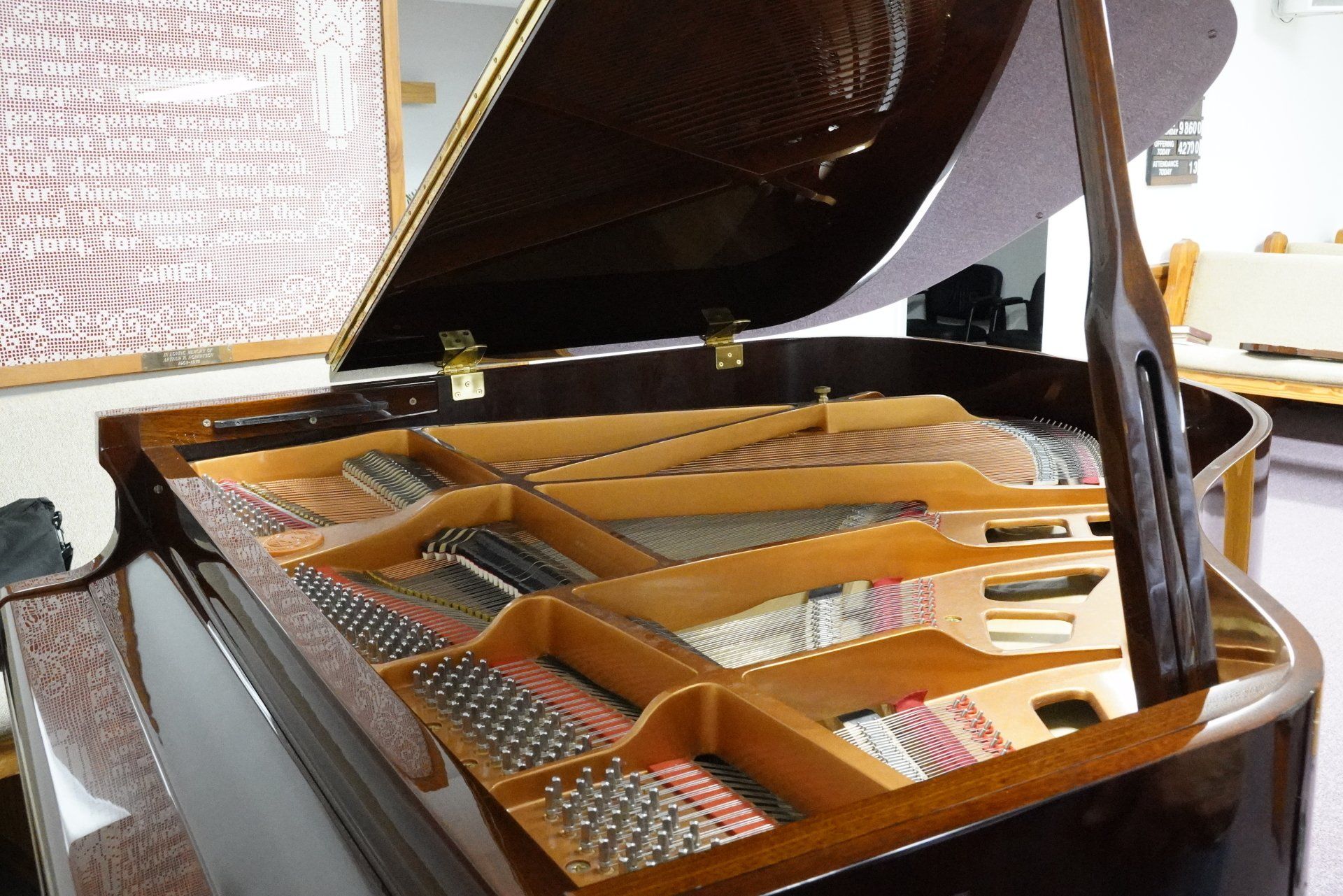 The inside of a grand piano with the lid open