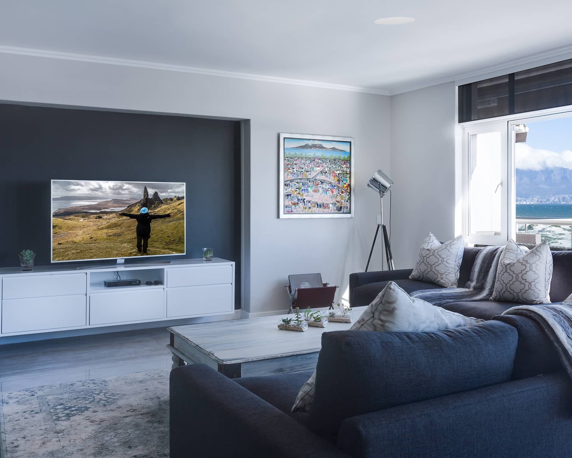 a living room with a couch and a flat screen tv