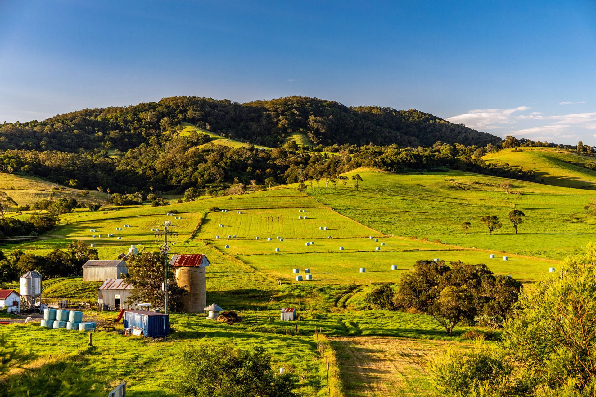 An aerial view of a beach with a city in the background.