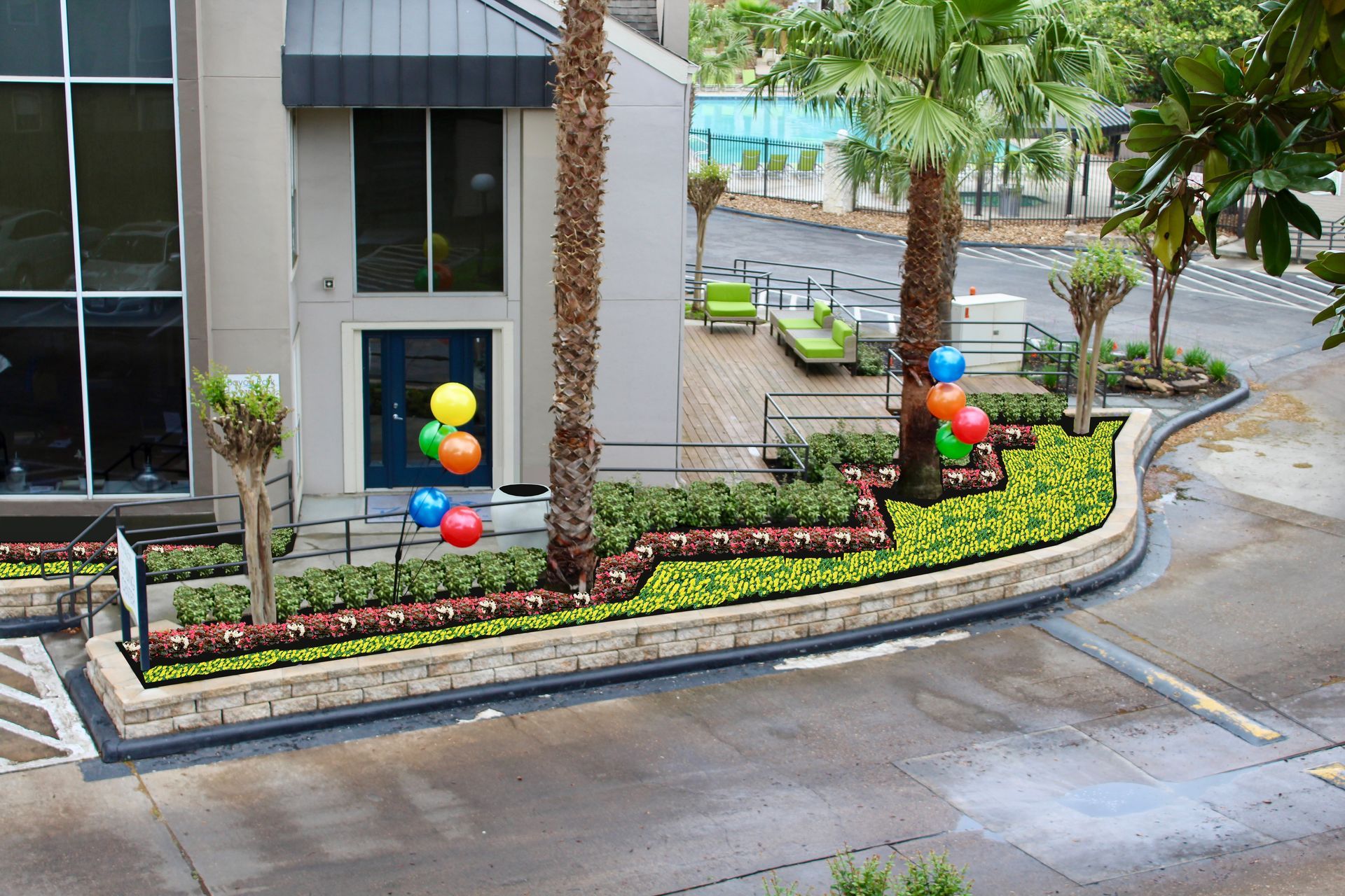 Exterior of a building with landscaping and balloons.