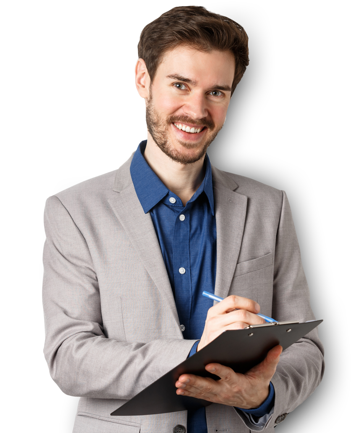 Man with beard, smiling, holding clipboard and pen, wearing gray blazer and blue shirt.