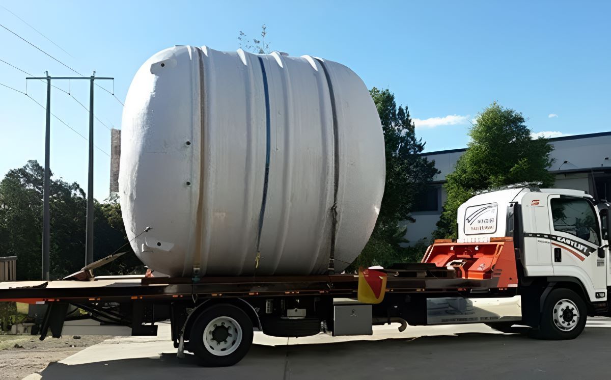 A Large White Cylinder Is on The Back of A Truck — Easylift Towing NSW Pty Ltd In Beresfield, QLD