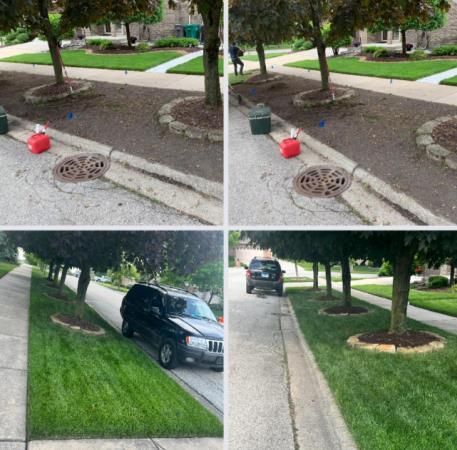 A black suv is parked on the side of the road