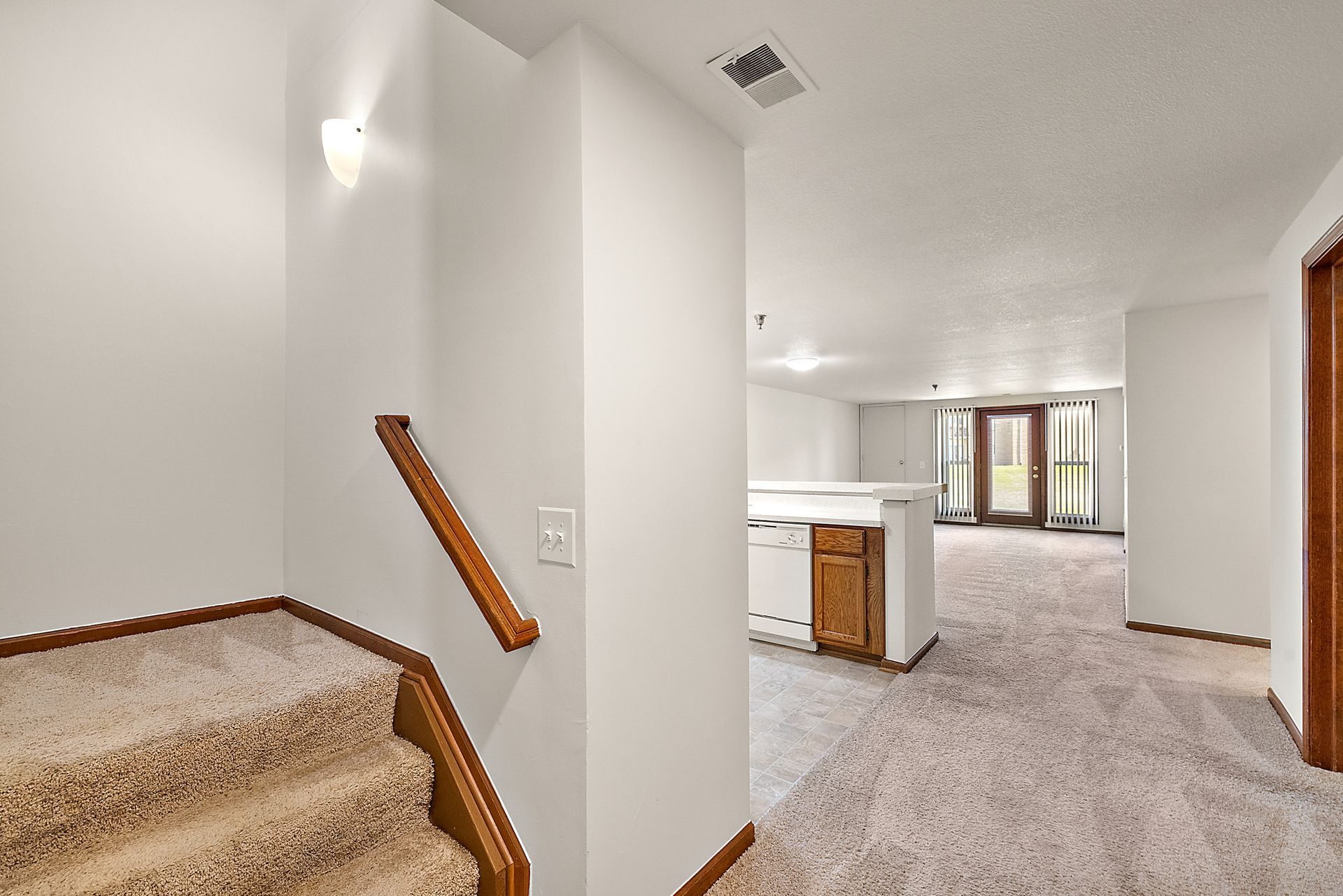 There is a staircase leading up to the second floor of a house.