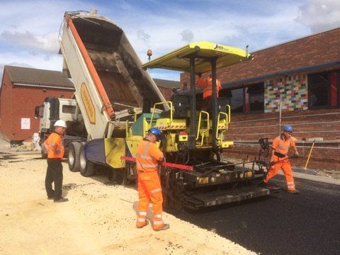 Asphalt being tipped from a truck