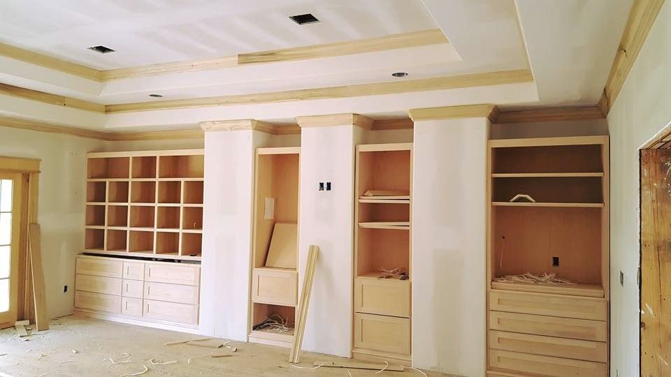 A house with a screened in porch and stairs in front of it.