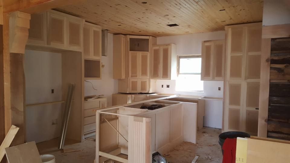 A bathroom with a sink , toilet and walk in shower.