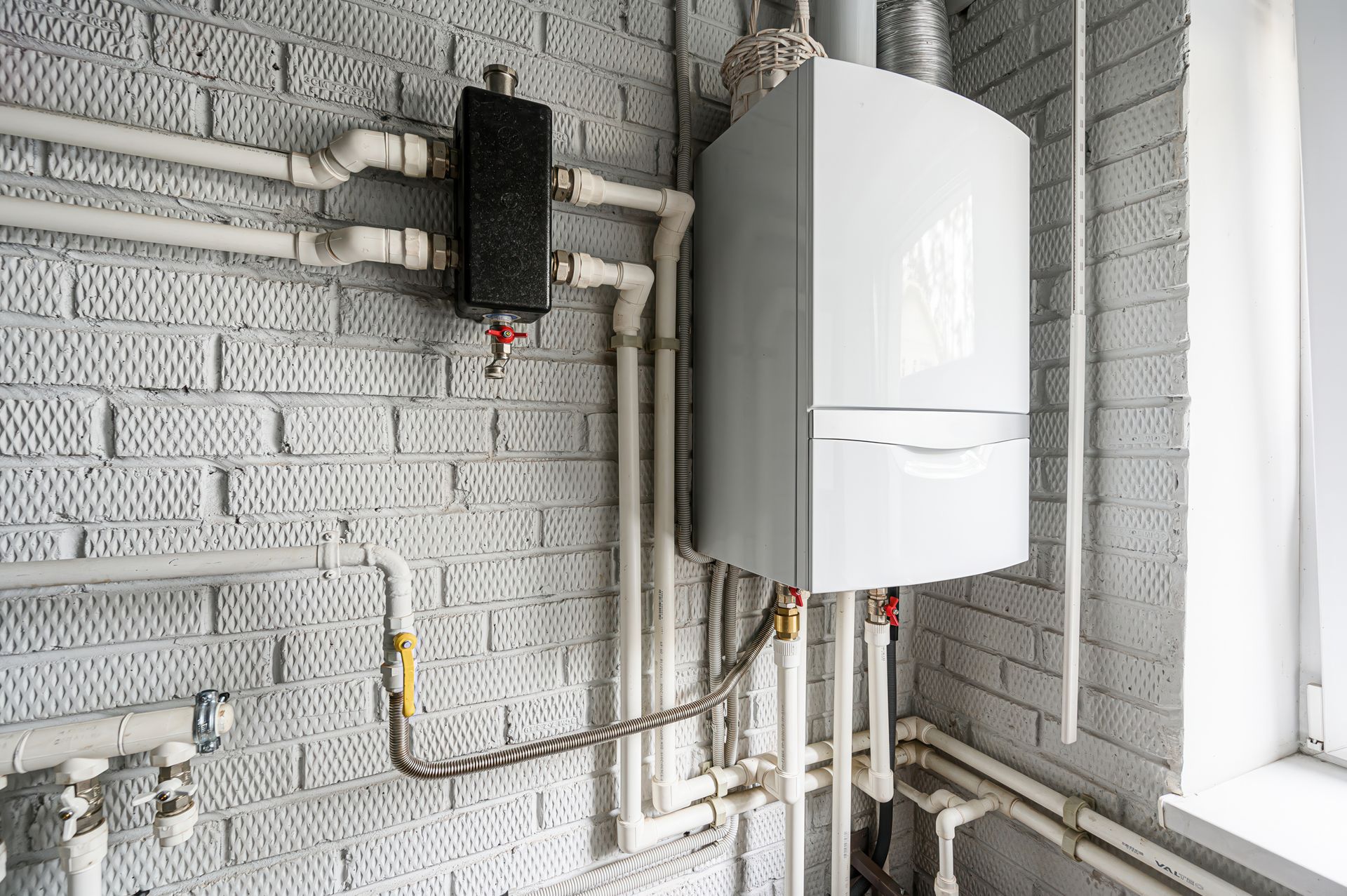 Gas water heater with control valve and flexible hose attached to the front panel