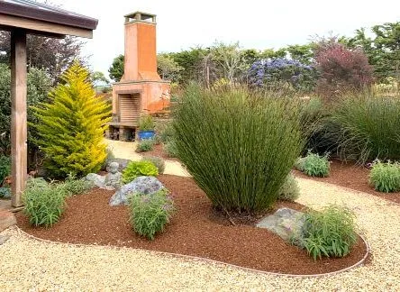 A walkway made of bricks and rocks in a garden.