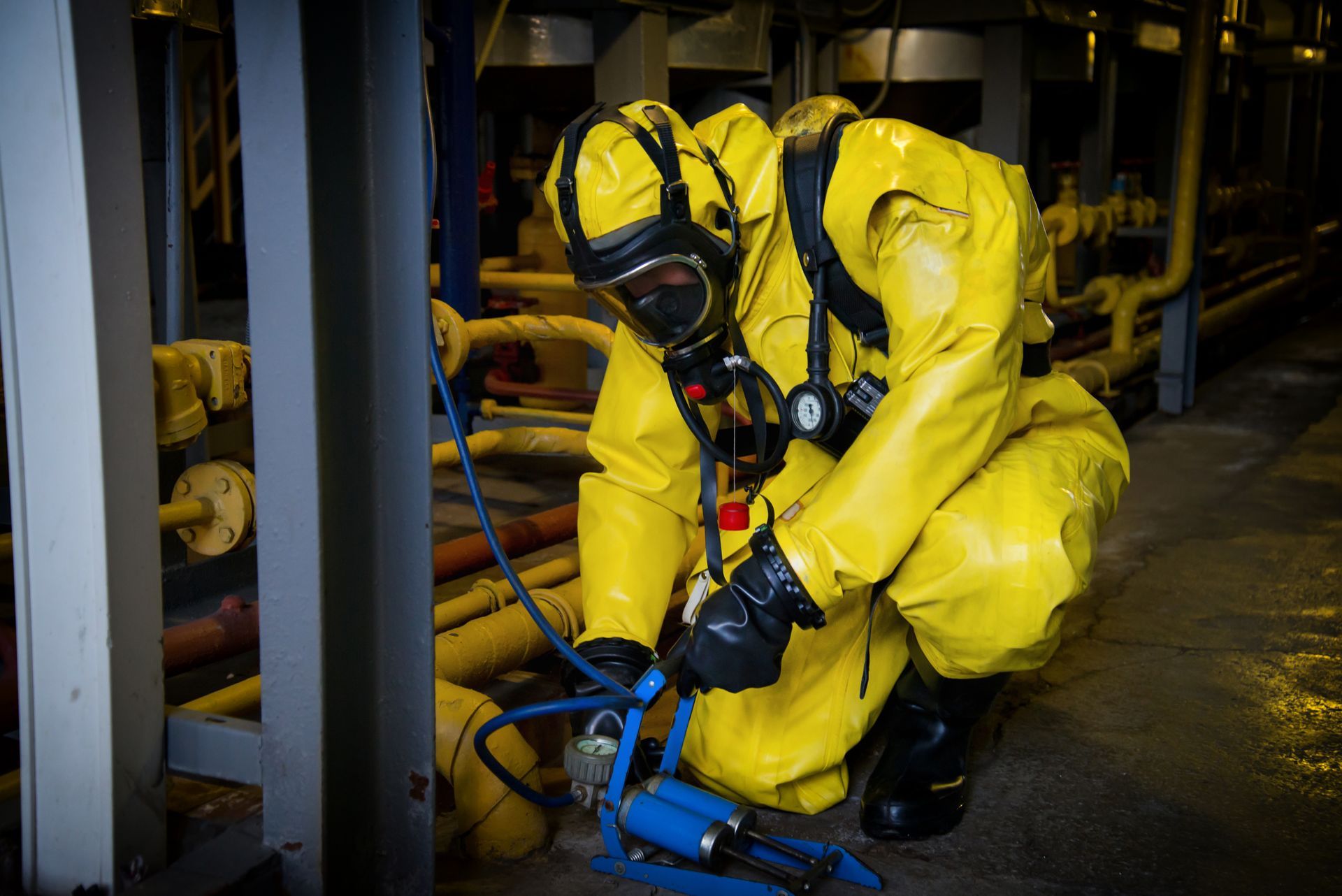 man wearing yellow protector checking radon