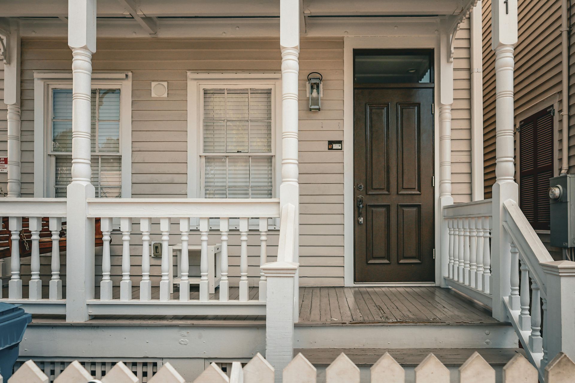A before and after picture of a house with a mailbox