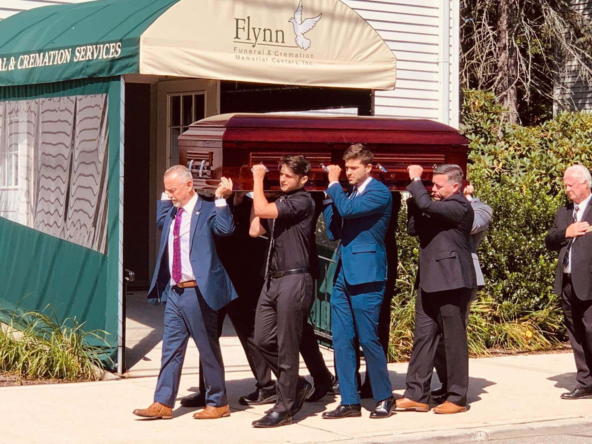 About Us Flynn Team Carrying Casket