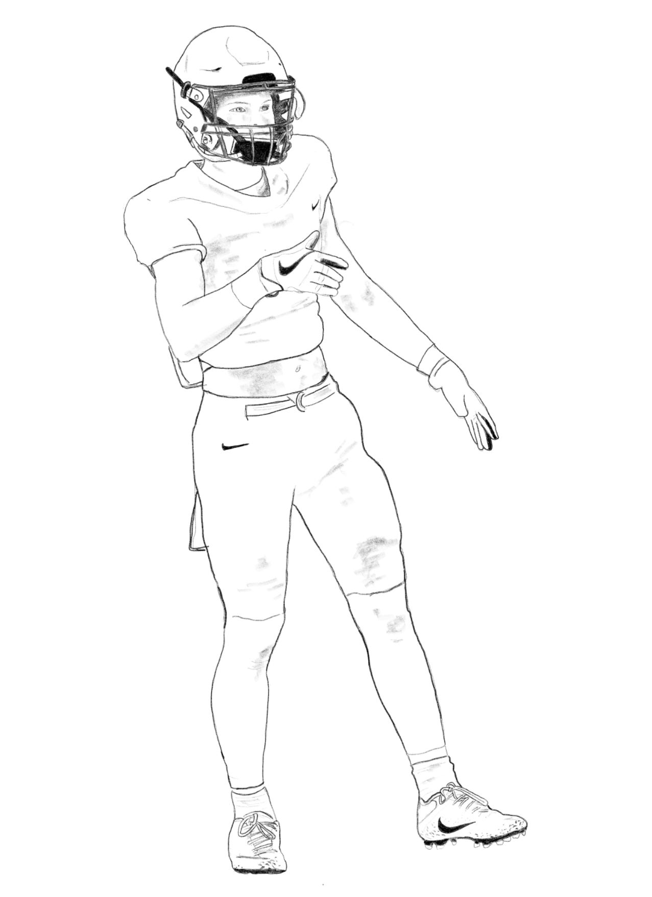 Football player in uniform, holding his arm.