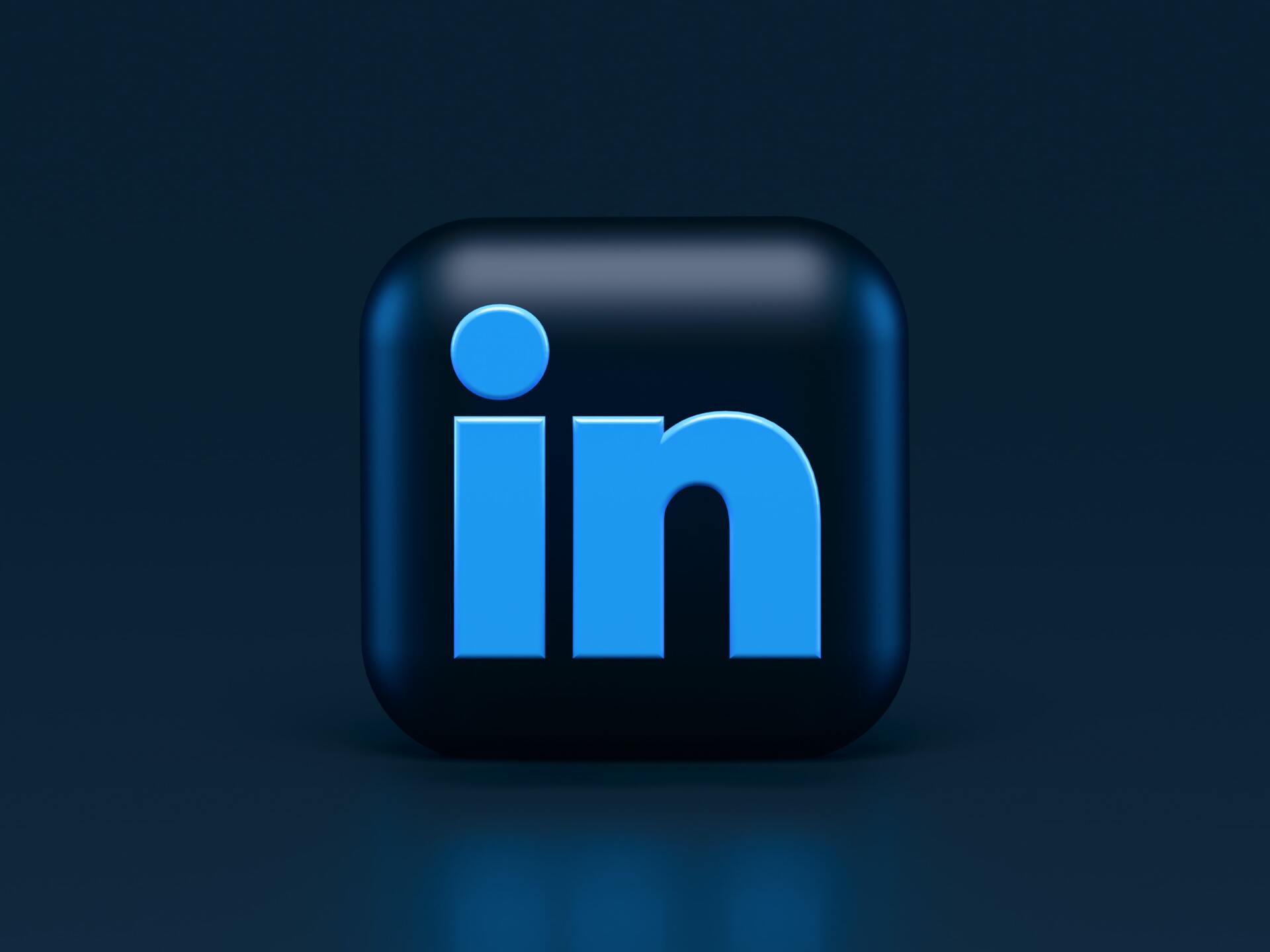 A blue and black linkedin logo on a dark blue background