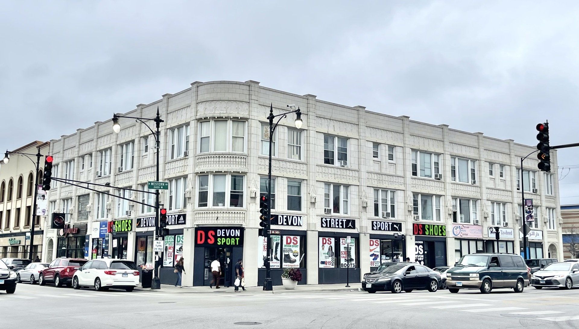 Exterior of 2349 W. DEVON BUILDING with retail stores on first floor.