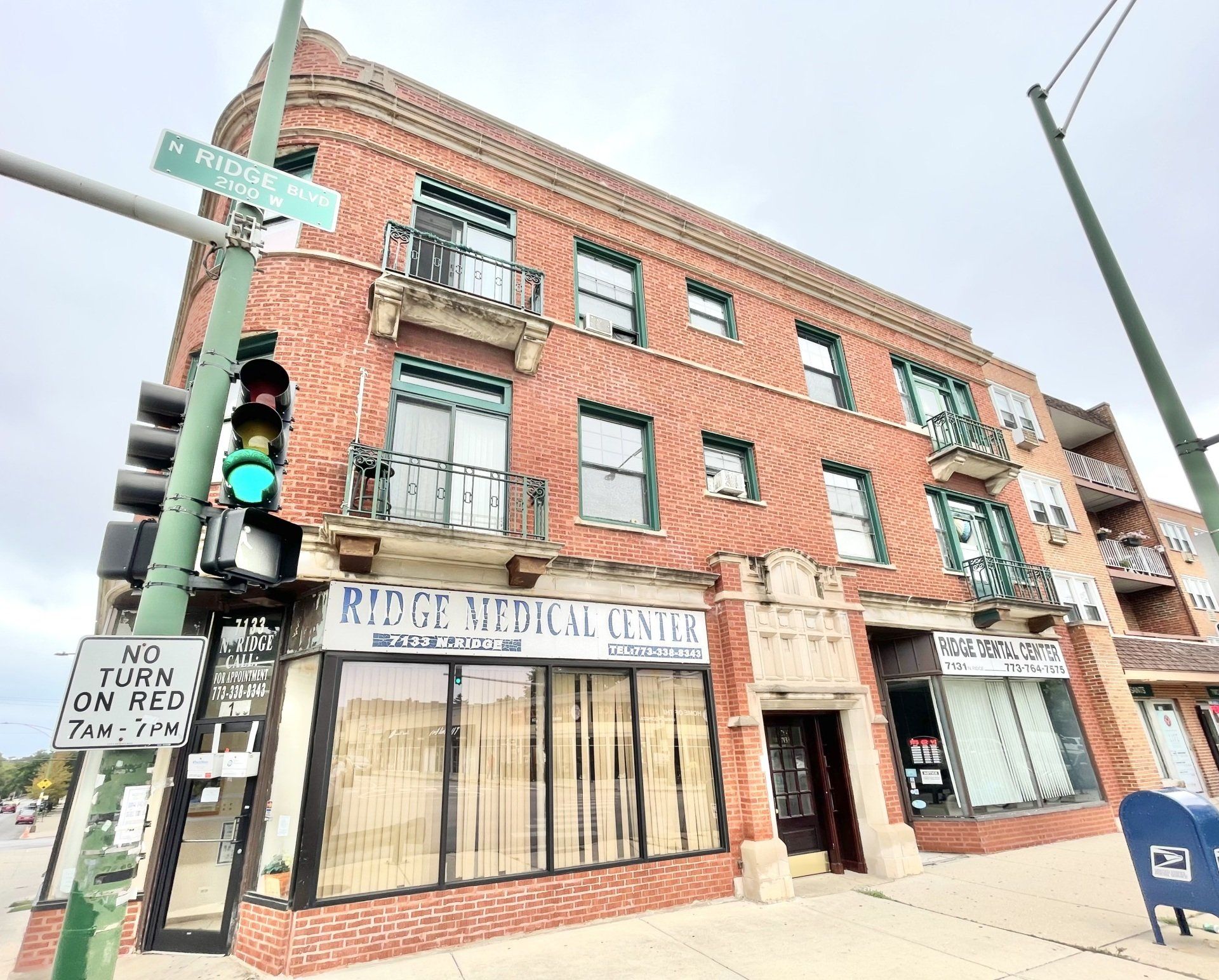Exterior of 7131 N. RIDGE BUILDING with retail stores on the first floor.