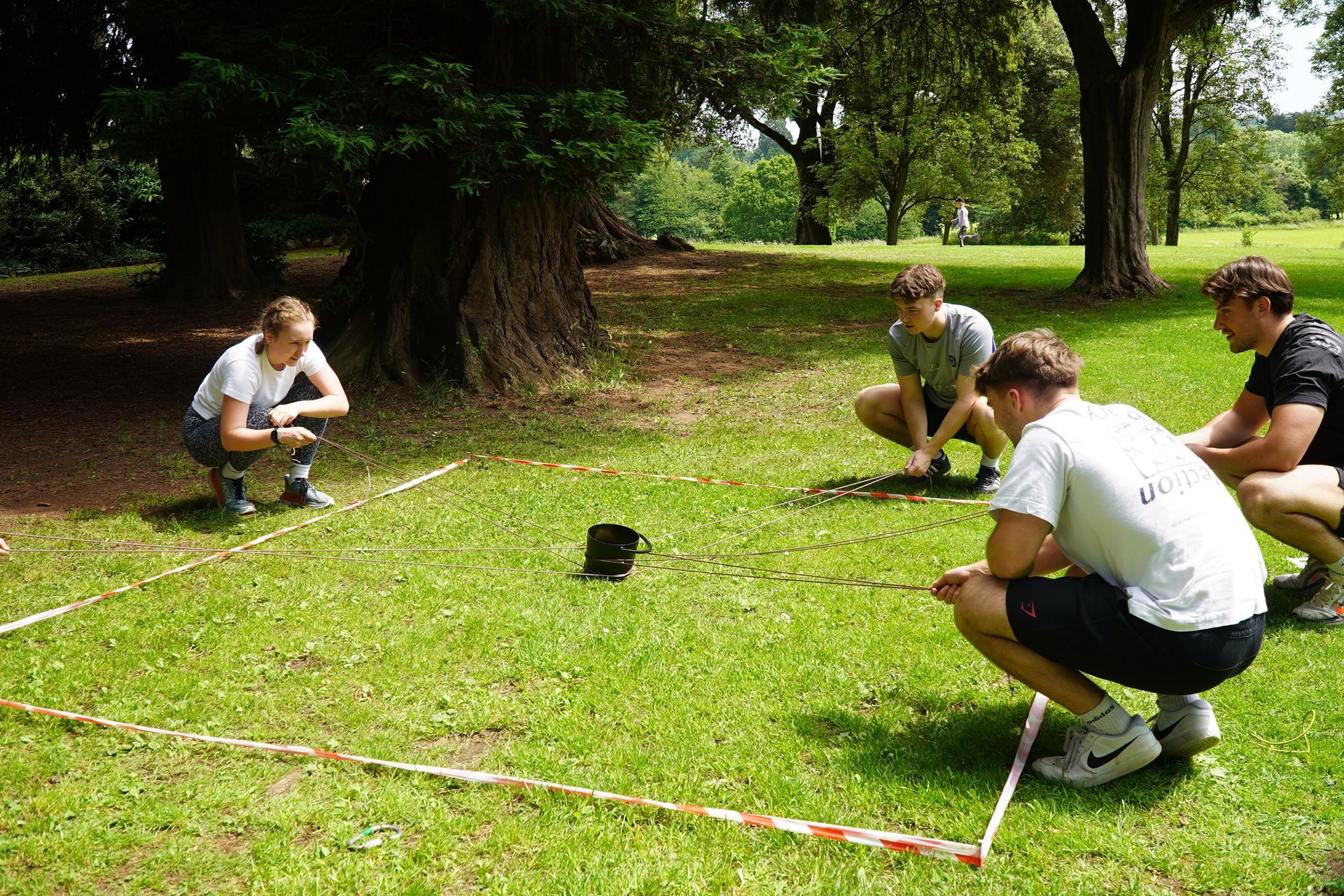 Corporate team attempting to defuse a bomb on their Bristol Team Building day  outdoor activities near me