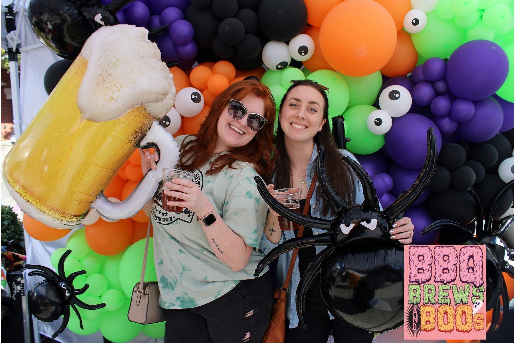 A group of people are posing for a picture in a photo booth.