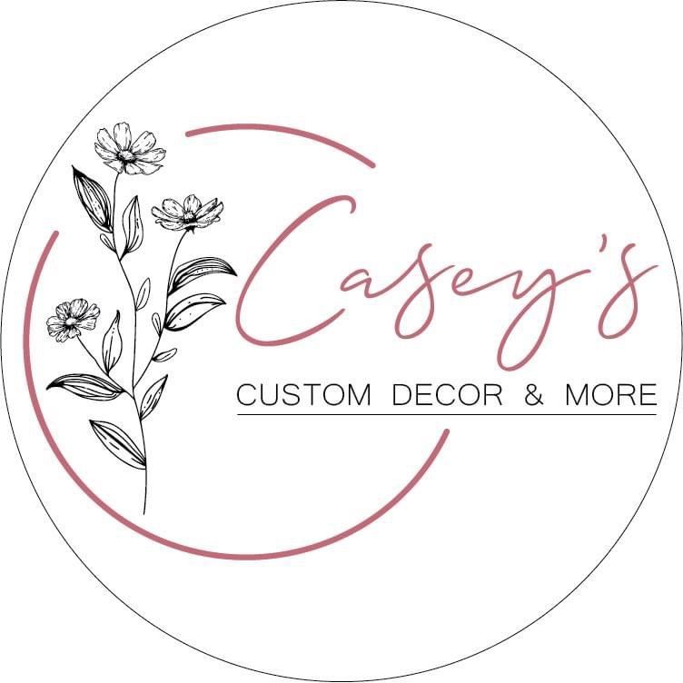 A logo for a company called casey 's custom decor and more.
