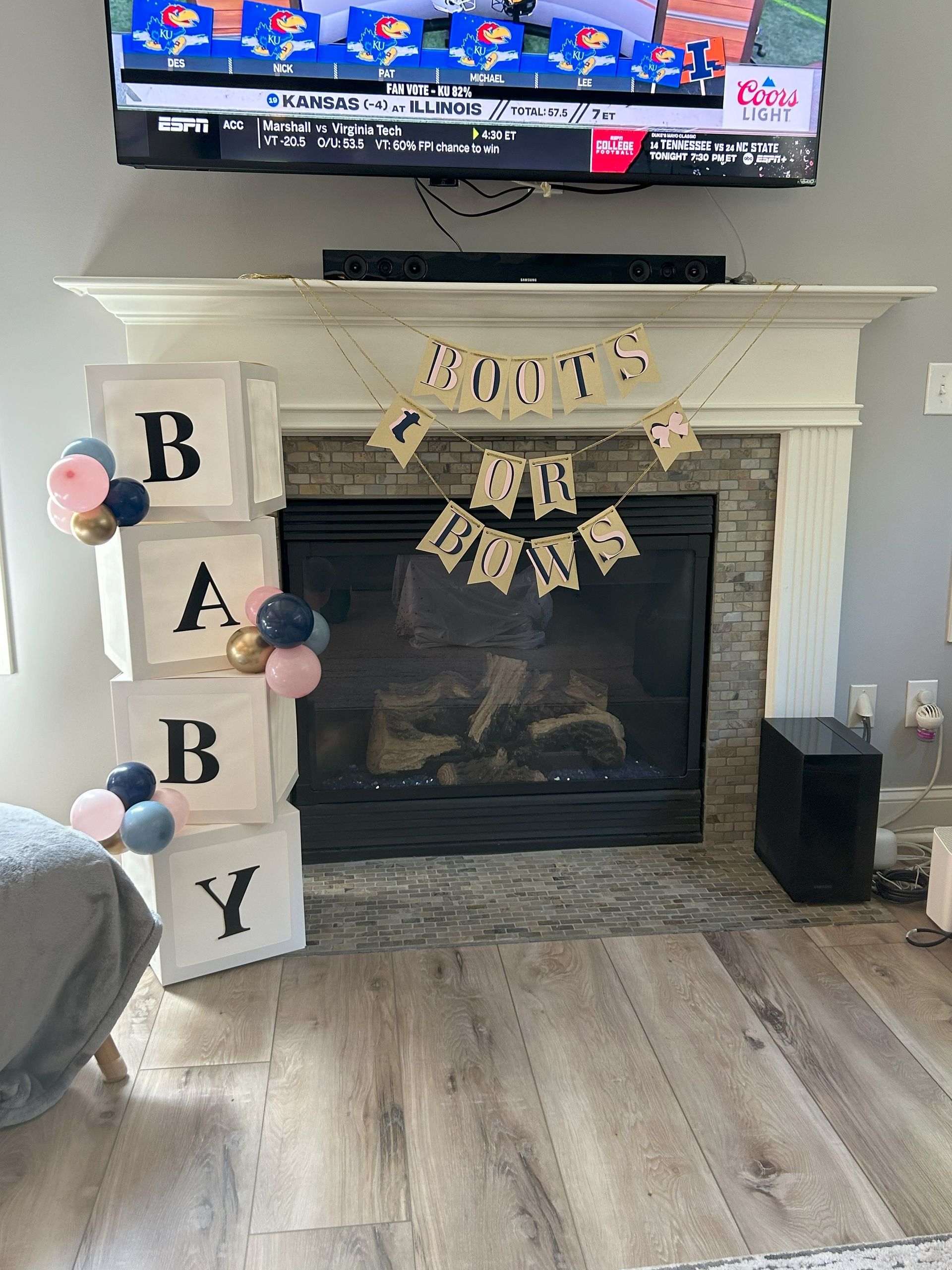A living room with a fireplace and a television.