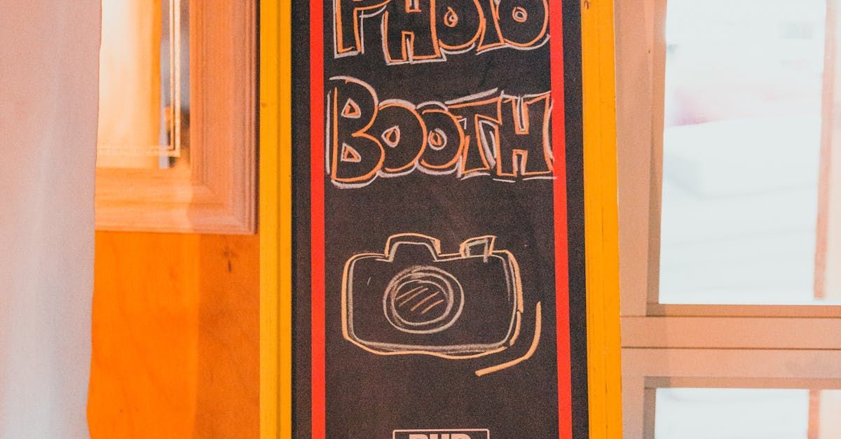 A blackboard with the words photo booth written on it