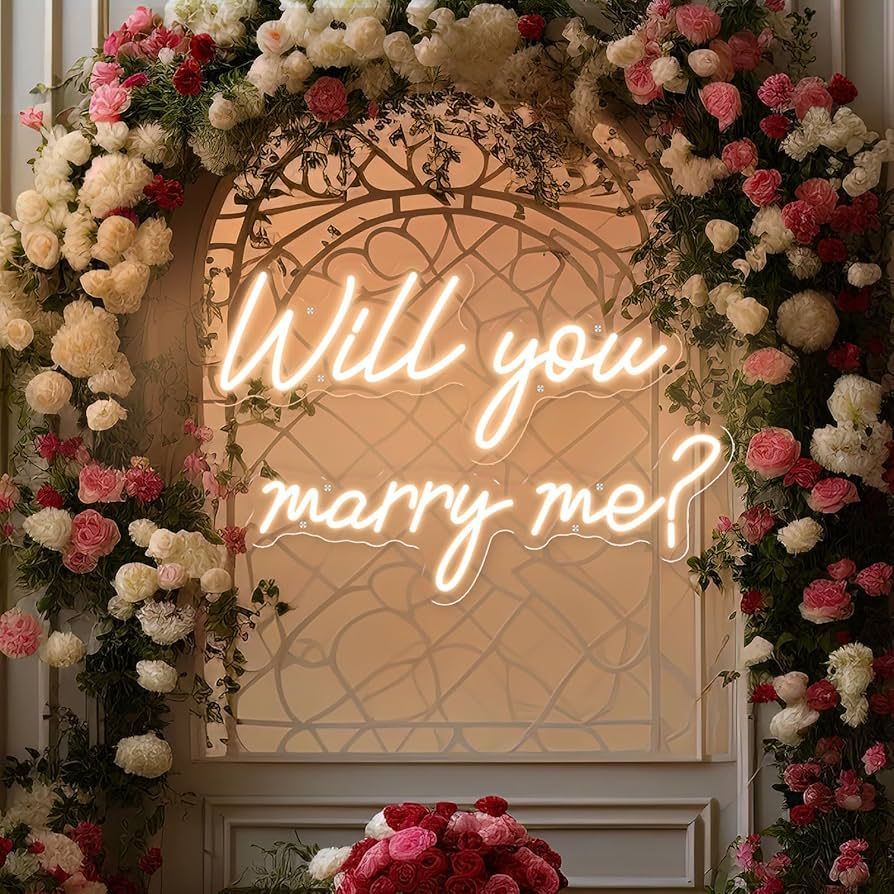 A neon sign that says will you marry me