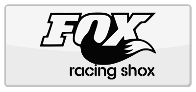 Fox Racing Shox logo: white letters with black fox tail on a gray background.