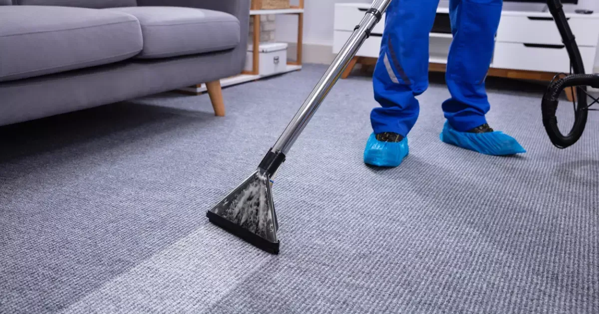 Technician deep cleaning carpet with expert carpet care near me using professional equipment