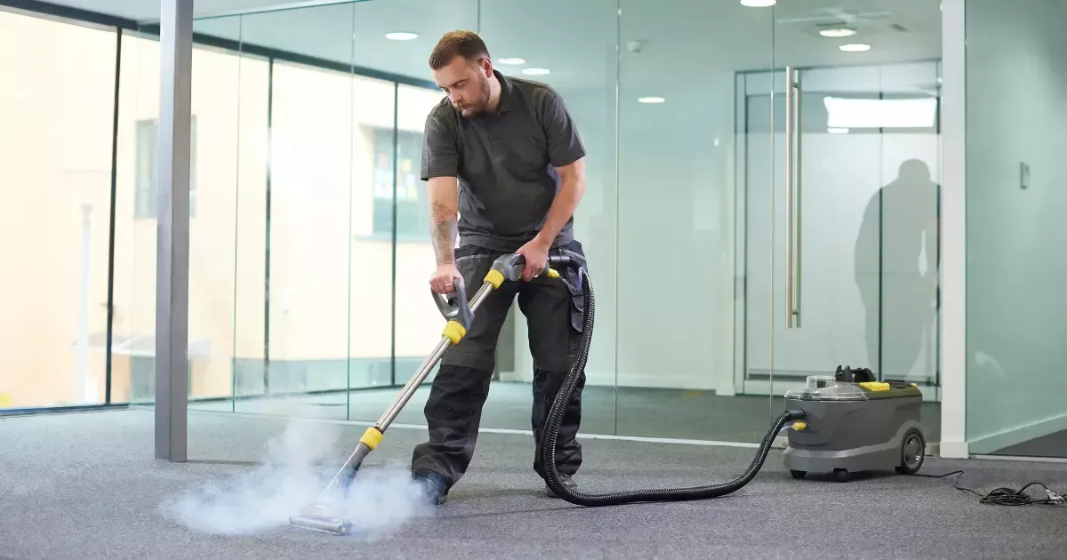 A person using a vacuum cleaner
