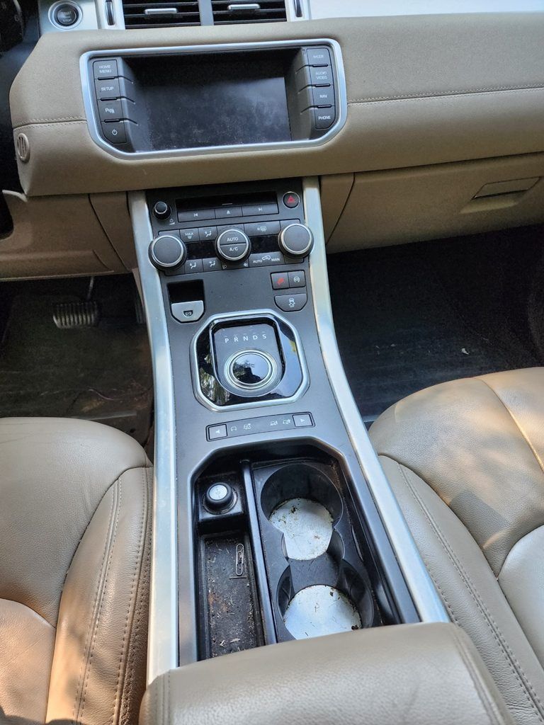 The dashboard of a range rover evoque is shown