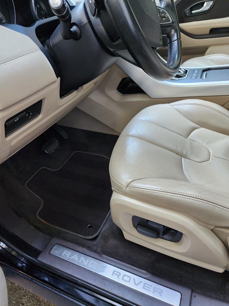 The inside of a range rover with the door open