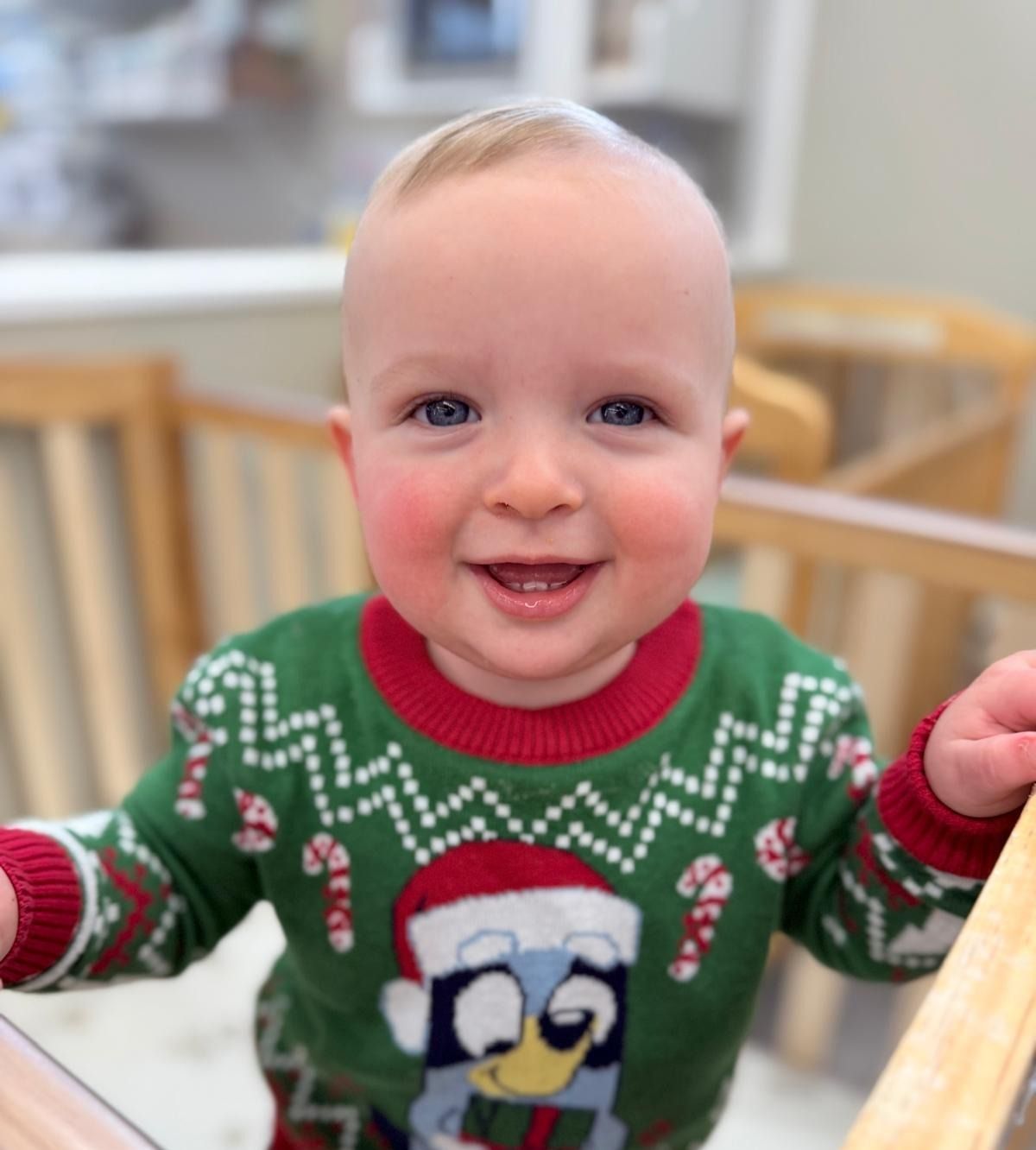 A teacher is teaching a group of children in a classroom.